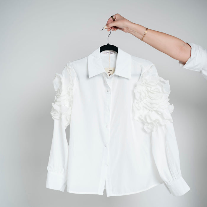 Blusa piedras en brazos