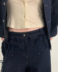 Jeans mezclilla oscura moños