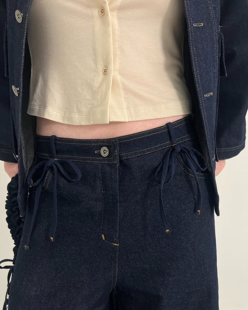 Jeans mezclilla oscura moños